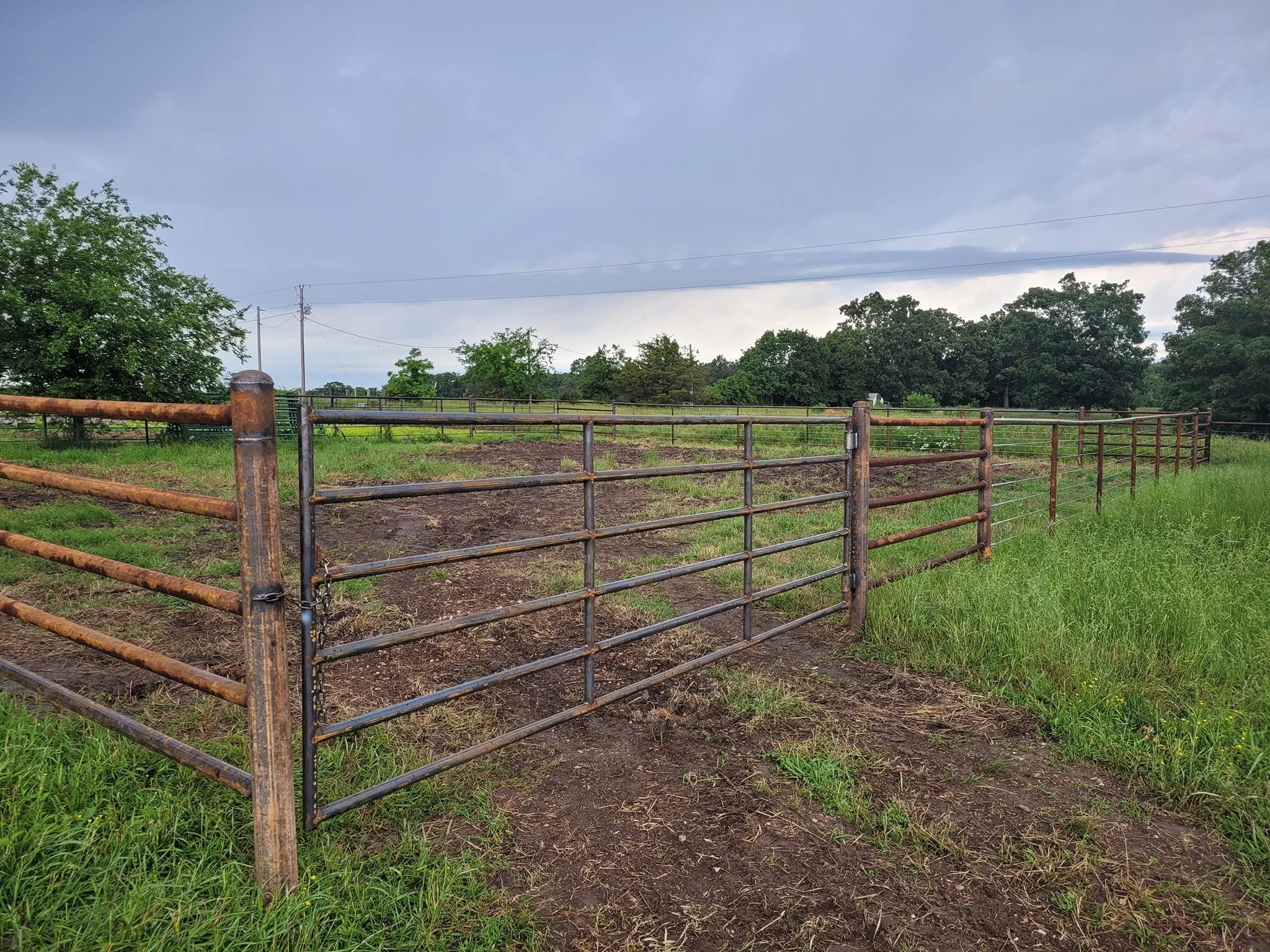 Field fence gate at the lot entrance