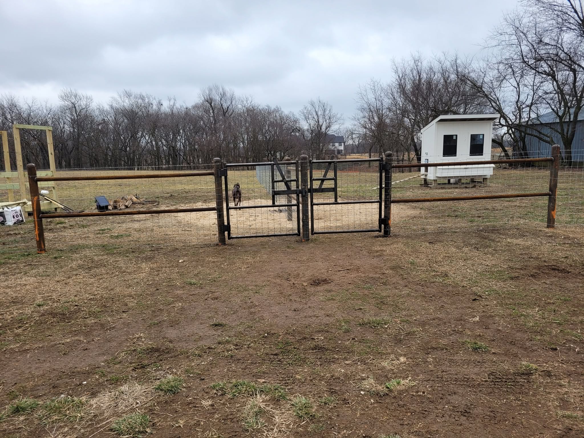 Custom gate and woven wire fence